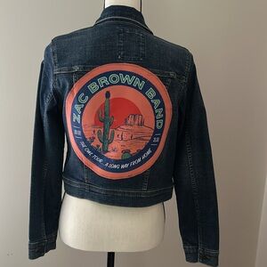 A FroggyBottomDesign denim jacket with Zac Brown Band patch on back.